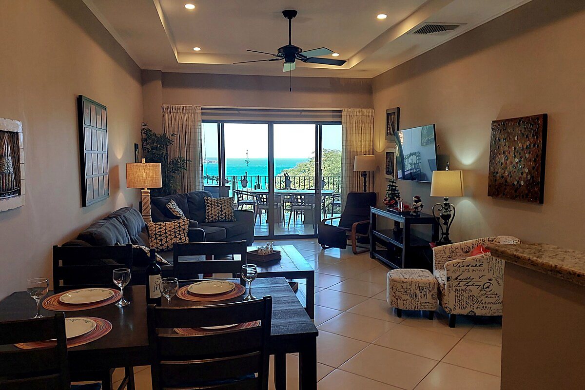 Open living and dining room with ocean view