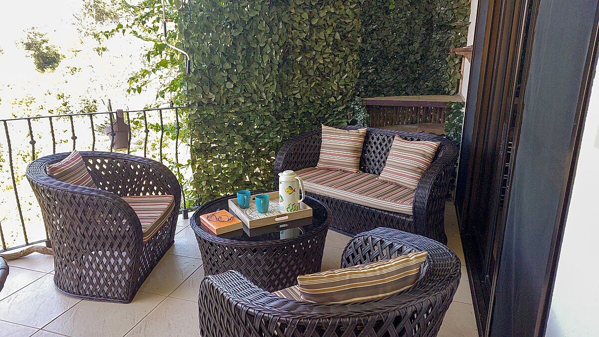 Terrace seating surrounded by greenery